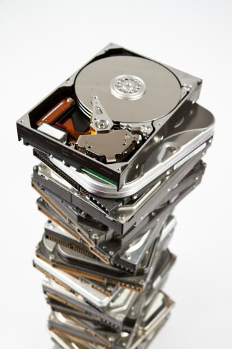 Stack of hard drive with opened one on top